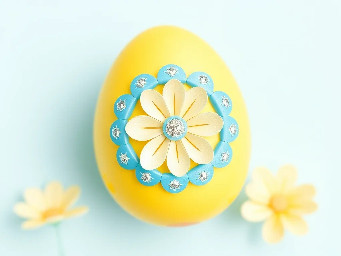 Yellow pastel egg, blue ring over yellow, sparkly flower and circle stickers