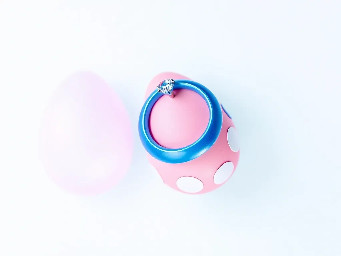 pink glitter egg, tiny diamond garnett, blue ring over pink egg, neon rainbow, and circle stickers