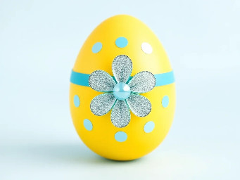 Yellow pastel egg, blue ring over yellow, sparkly flower and circle stickers
